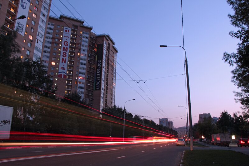 City street at dusk with light trails