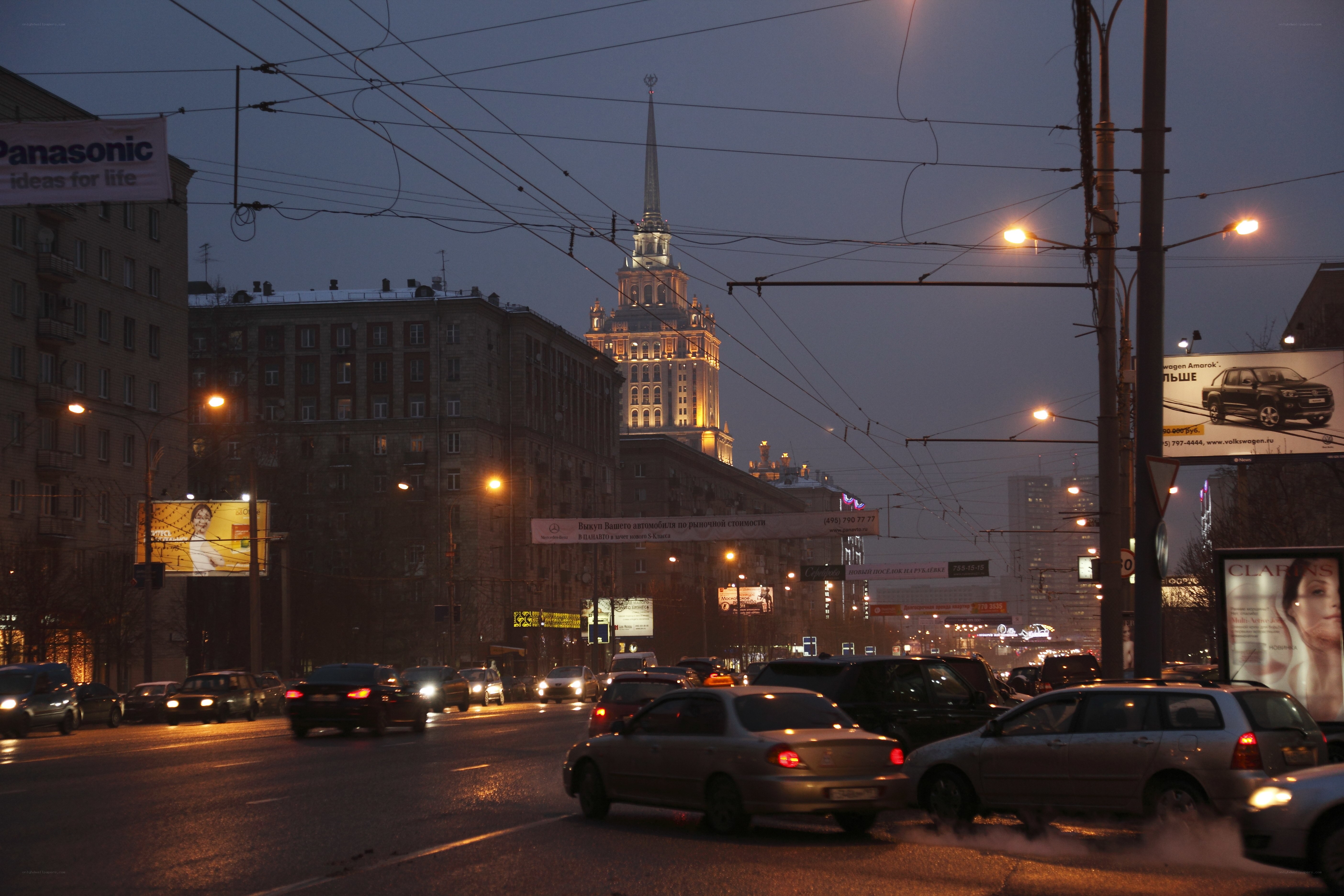 City street at dusk with skyscraper