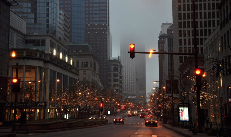City street at dusk with traffic