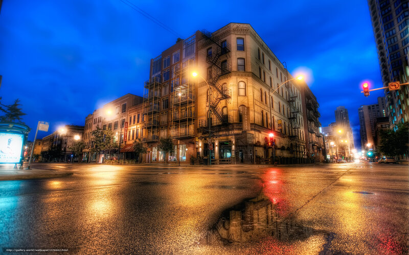 City street at dusk with wet pavement