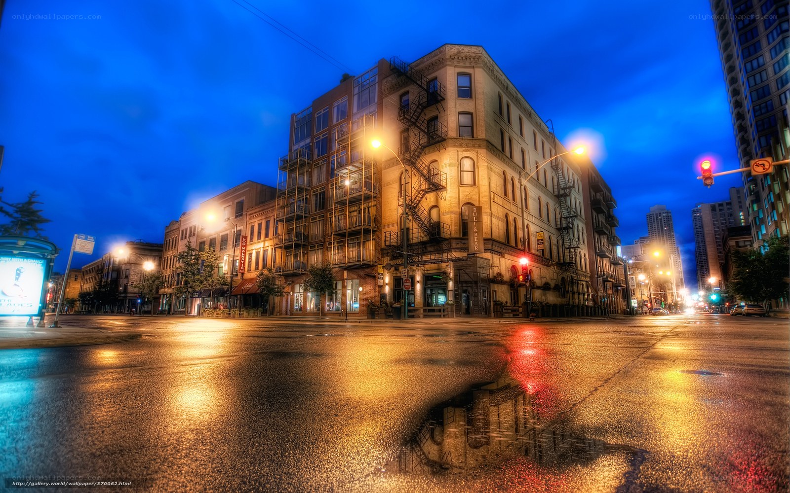 City street at dusk with wet pavement