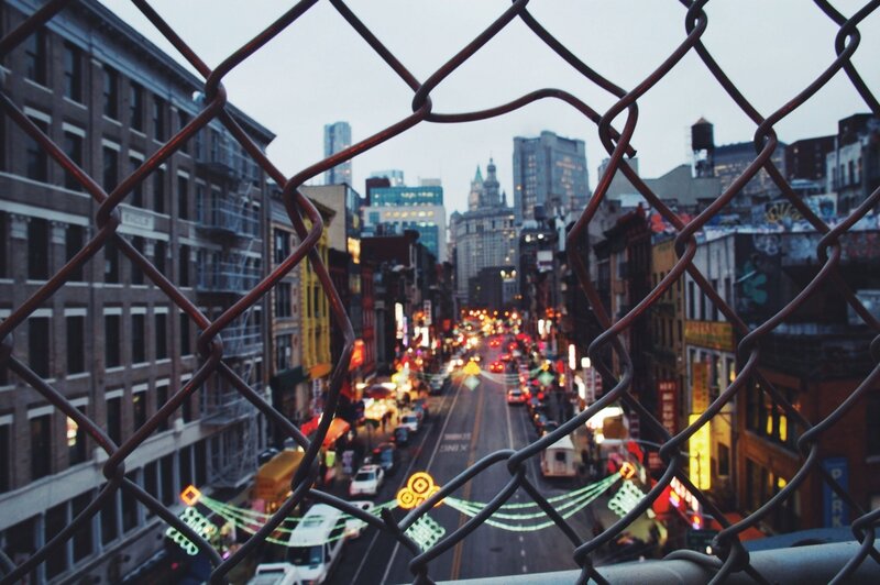 City Street Through Fence