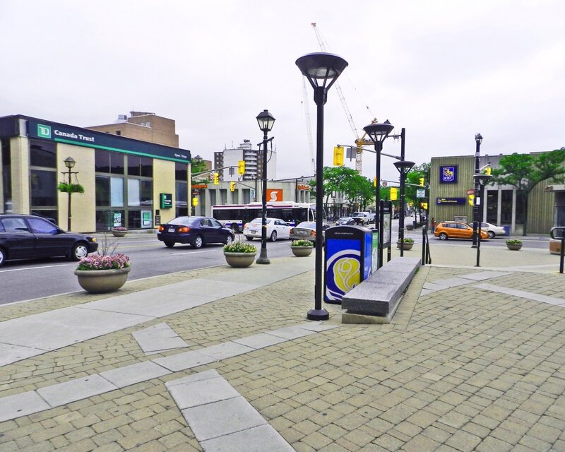 City street with bank and bus stop