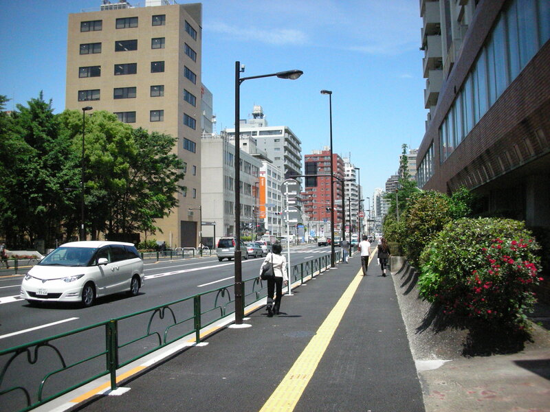 City street with pedestrians and traffic