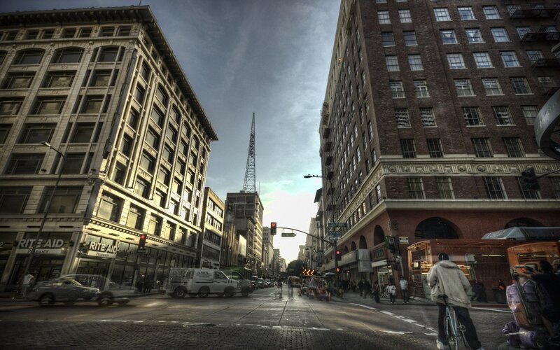 City street with Rite Aid and broadcast tower