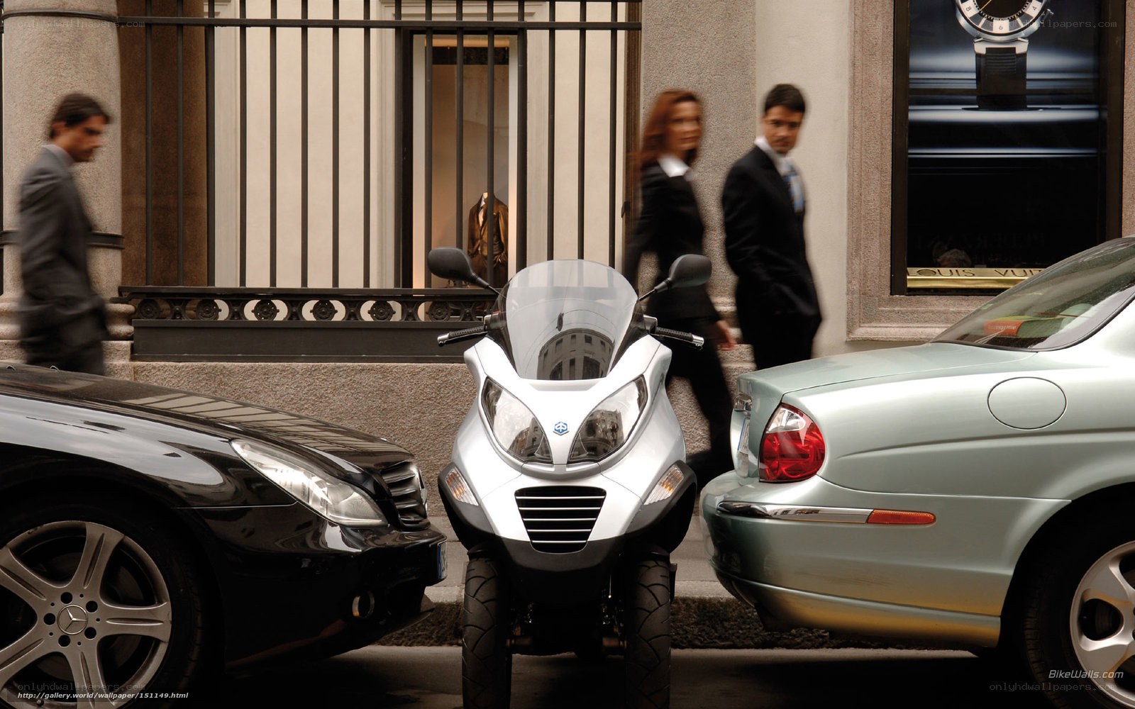 City street with scooter and cars