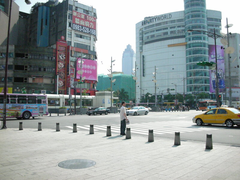City street with taxi and buildings
