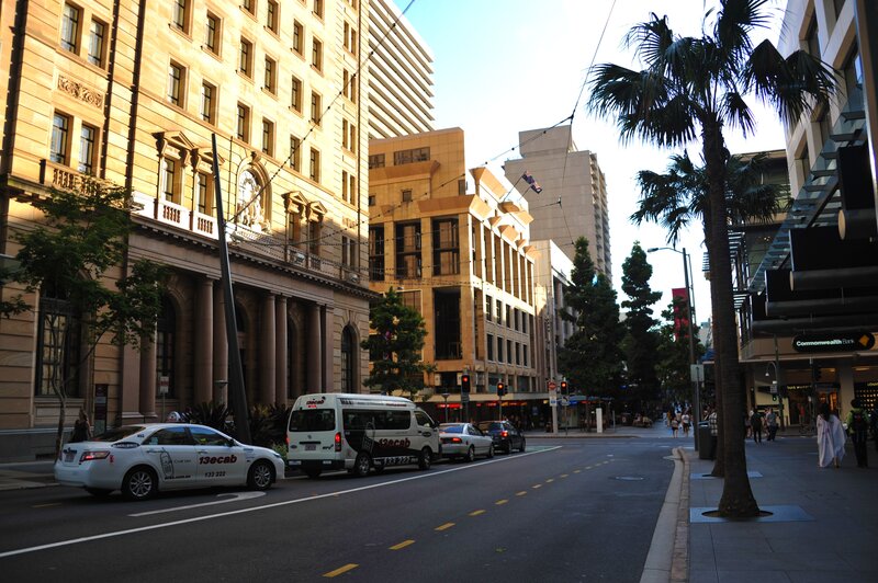 City street with taxis and palm trees