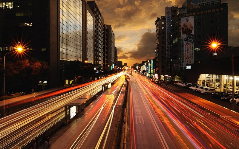 City traffic at dusk with light trails