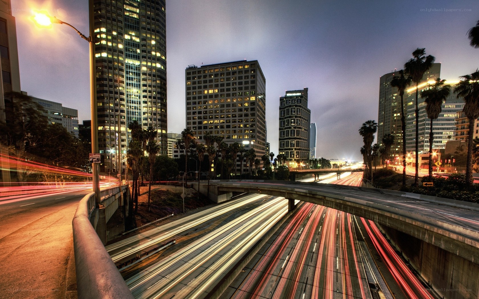 City traffic at dusk with light trails