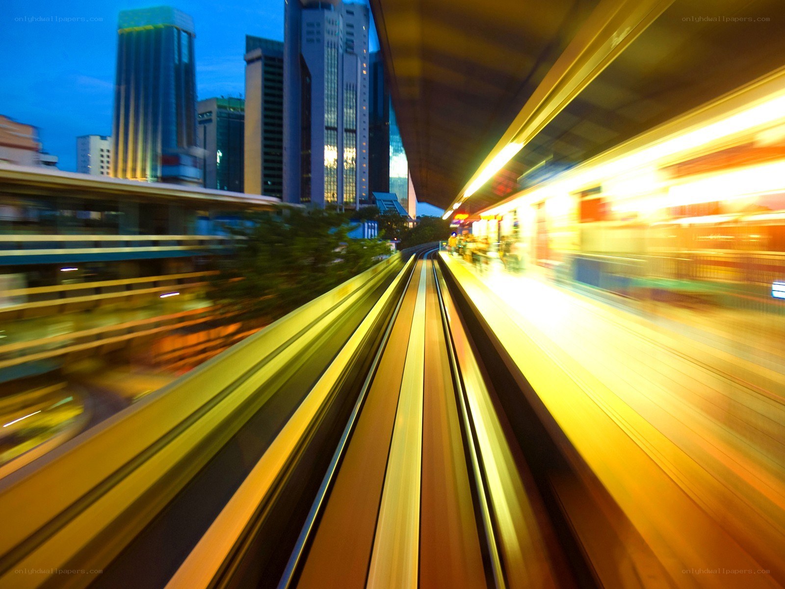 City train in motion at dusk