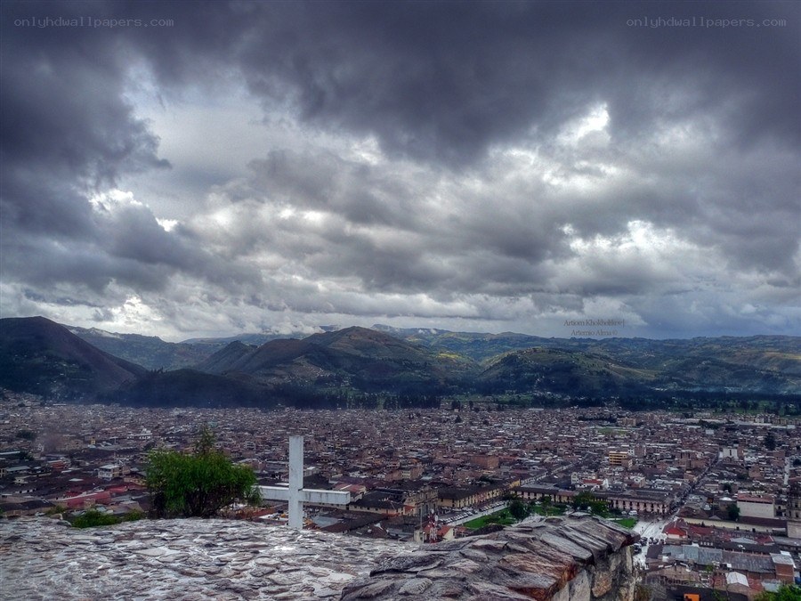 city under stormy sky