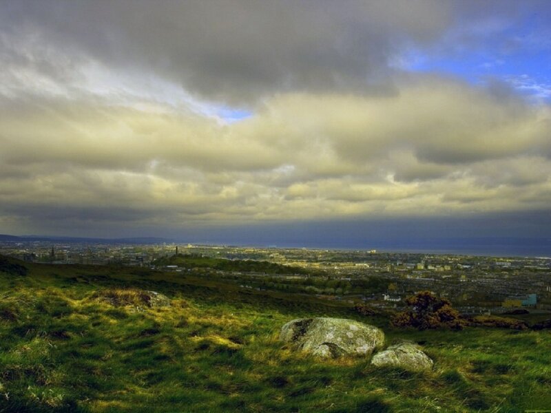 City View from Hill — Green, Dramatic, Afternoon, Photograph, Grass, Rocks, Clouds, Gray