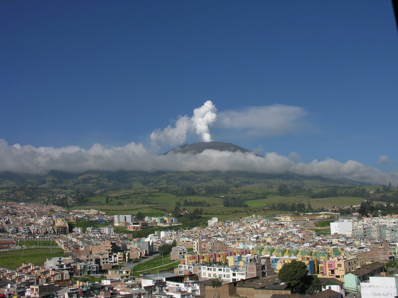 City with erupting volcano