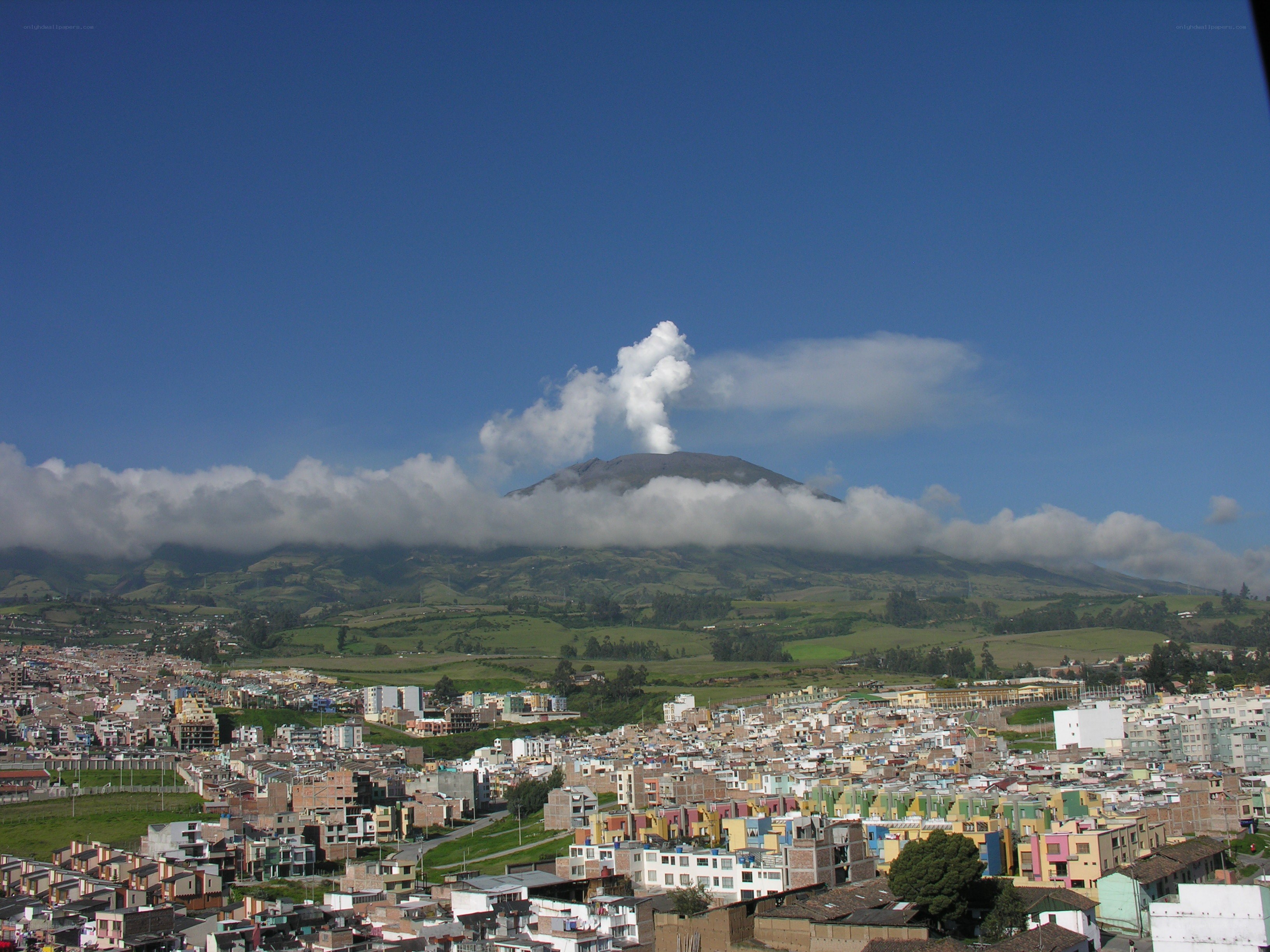 City with erupting volcano