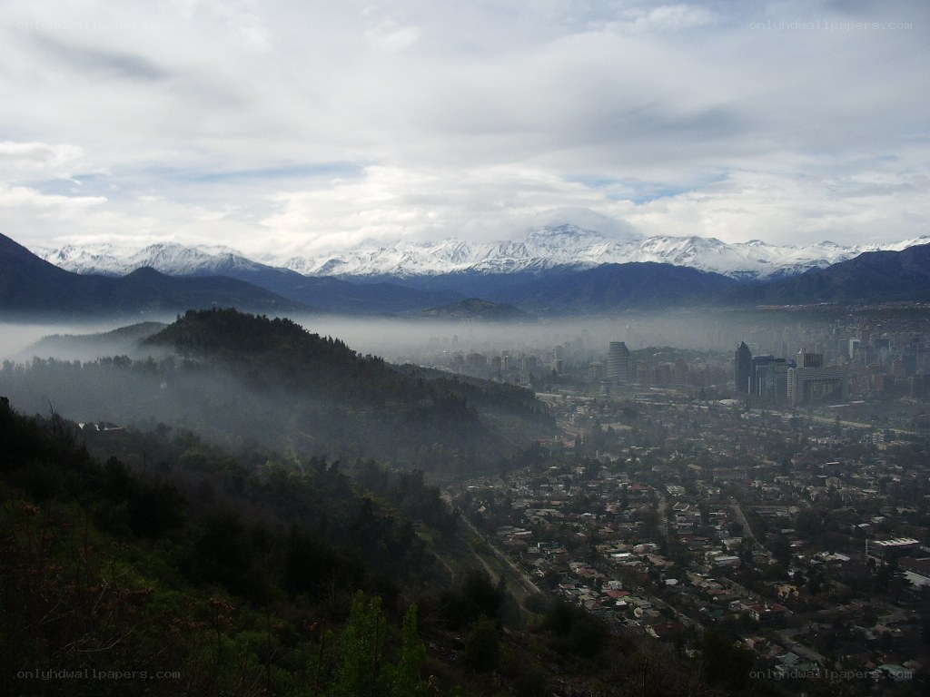 City with snow-capped mountains