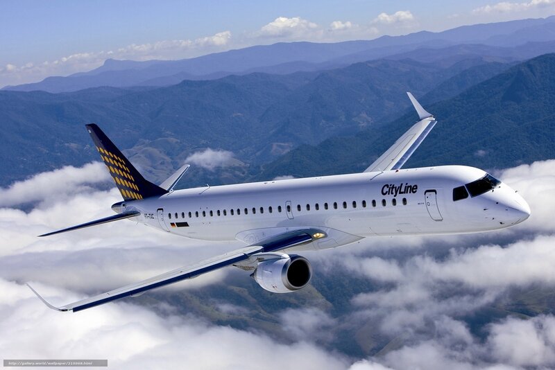 CityLine airplane flying over clouds