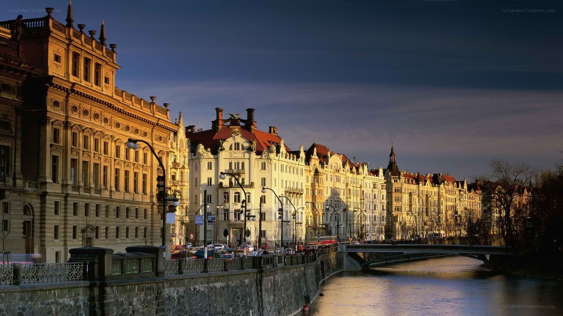 Cityscape along a river at dusk