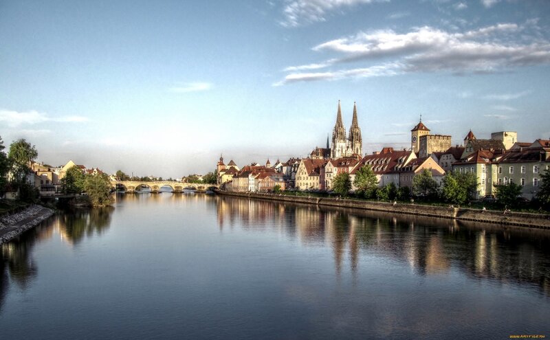 Cityscape Along River — Blue, Serene, Afternoon