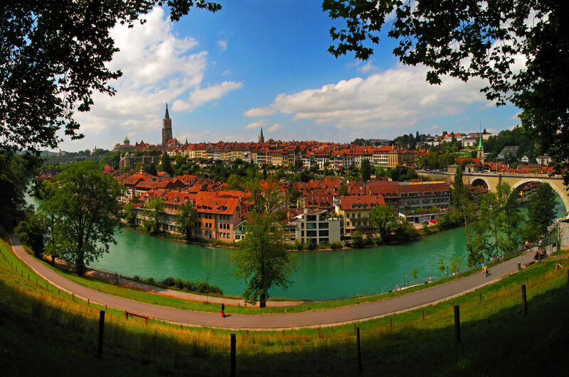 Cityscape Along River — Green