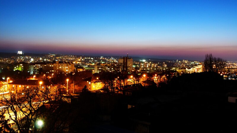 Cityscape at Dusk — Blue, Calm, Night, Photograph, Buildings, Streetlights, Trees