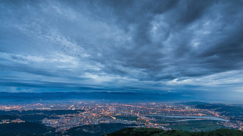 Cityscape at Dusk — Blue, Dramatic, Night, Photograph, Clouds, Mountains