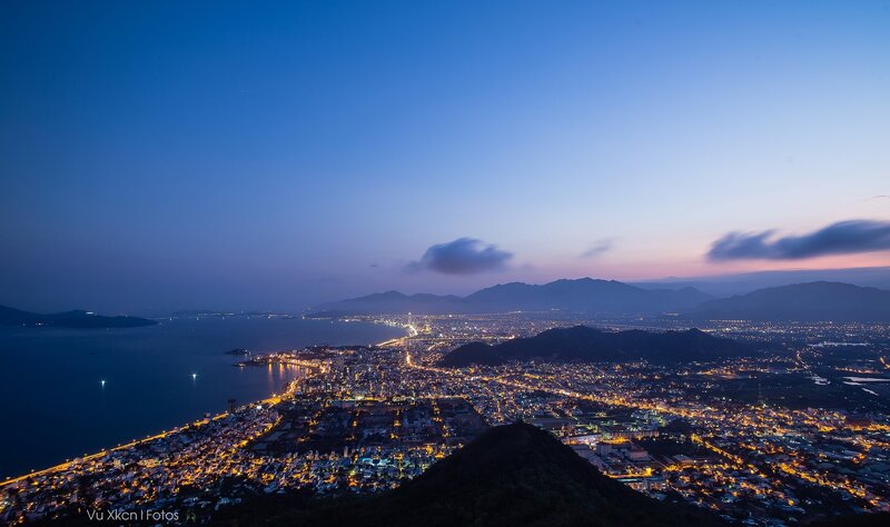 Cityscape at Dusk — Blue, Serene, Night, Photograph, Mountains, Sea