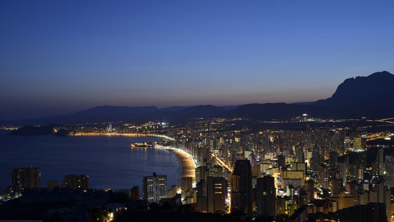Cityscape at Dusk — Blue, Serene, Night, Photograph, Sea, Mountains