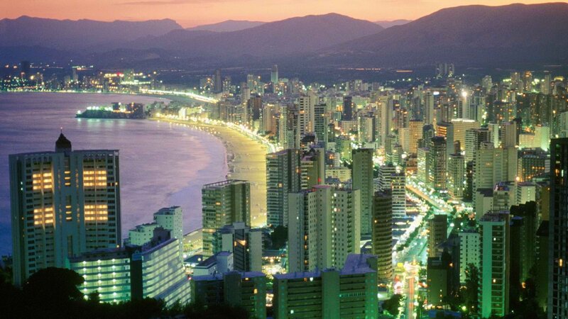 cityscape at dusk by the sea