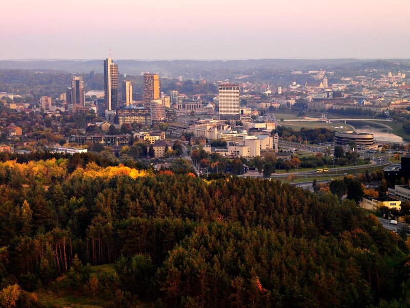 Cityscape at dusk with autumn trees
