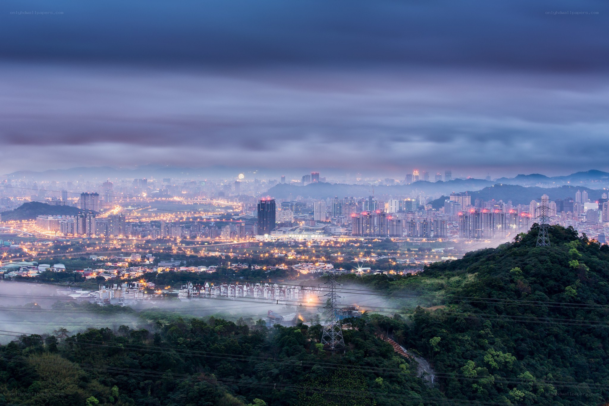 Cityscape at dusk with fog