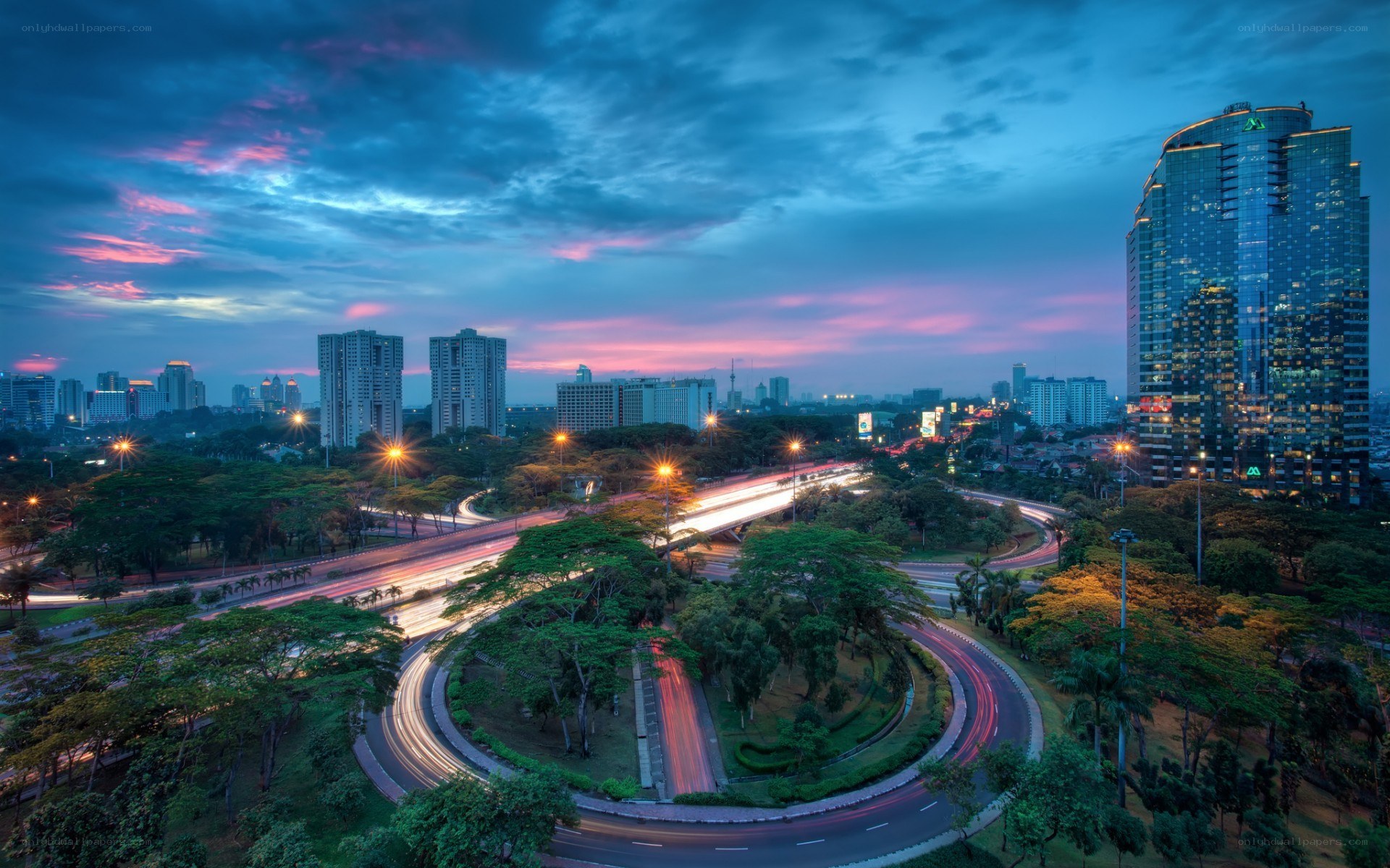 Cityscape at dusk with light trails