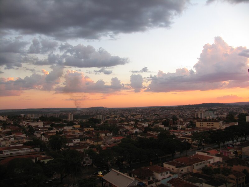 Cityscape at Sunset — Orange, Dramatic, Photograph, Clouds, Buildings, Trees, Gray