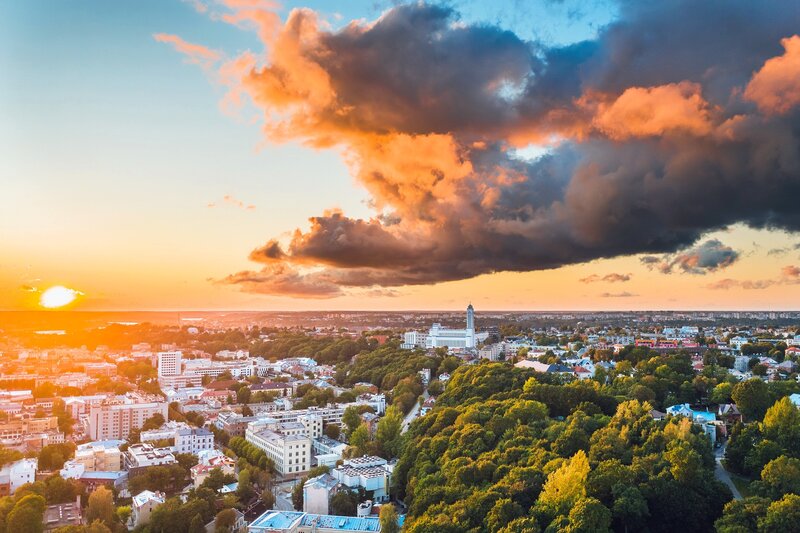 Cityscape at Sunset — Orange, Dramatic, Photograph, Clouds, Trees
