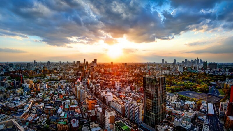 Cityscape at Sunset — Orange, Dramatic, Photograph, Skyscrapers, Highway, Trees, Clouds