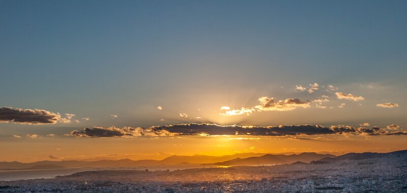 Cityscape at Sunset — Orange, Serene, Photograph, Mountains