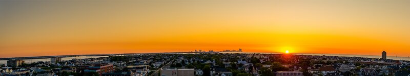 Cityscape at Sunset — Orange, Serene, Photograph, Sun, Buildings