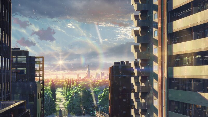 Cityscape at sunset with rainbow