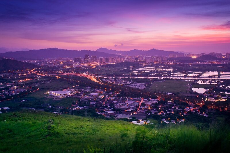 Cityscape at twilight with mountains