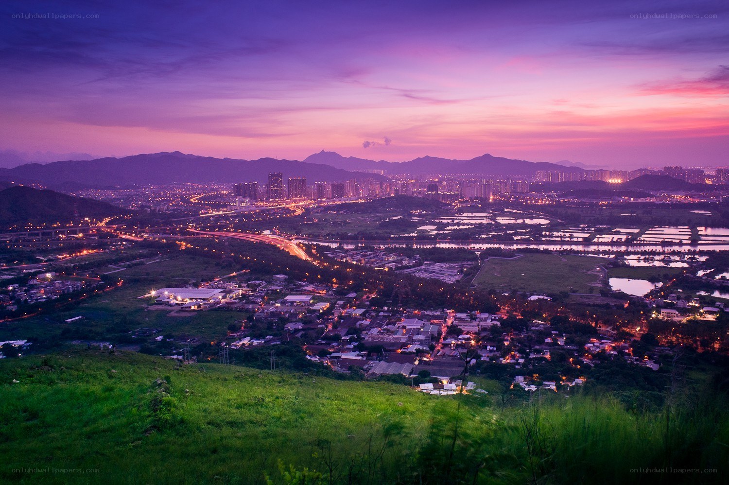 Cityscape at twilight with mountains