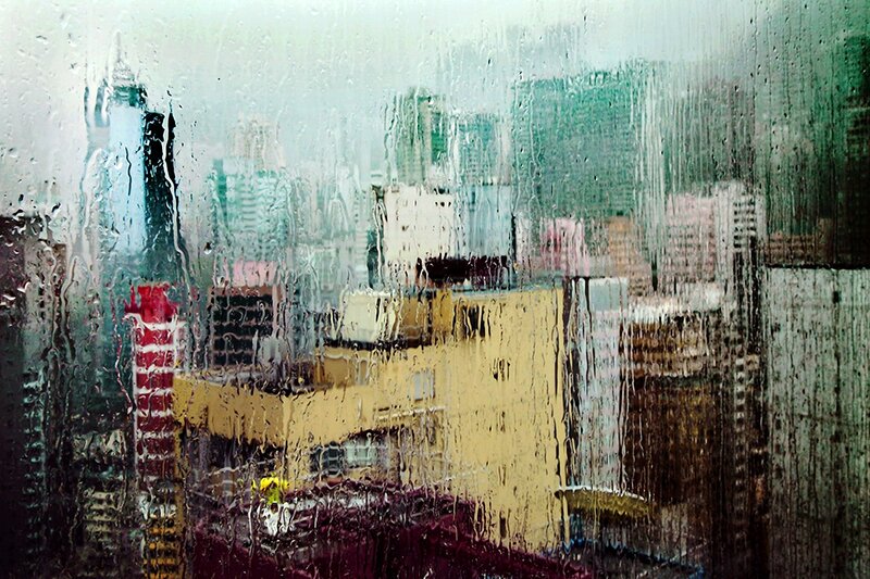 Cityscape Through Rain-streaked Window