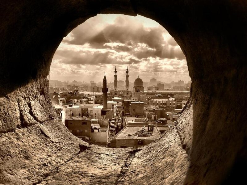 Cityscape Through Stone Arch