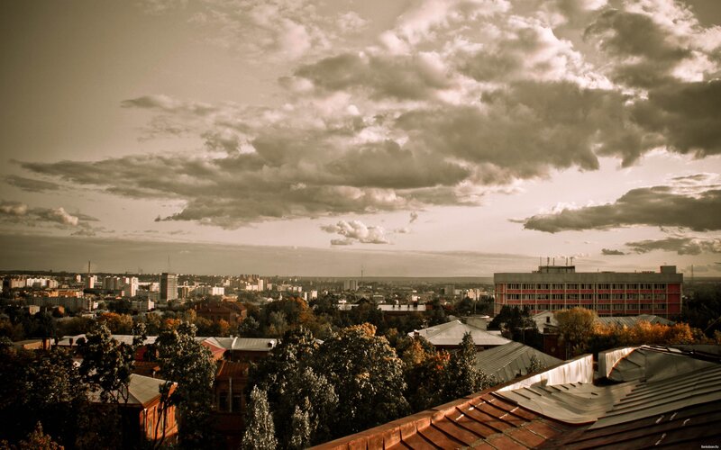 Cityscape under Cloudy Sky — Brown