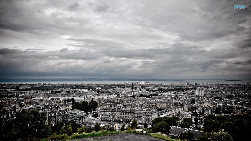 Cityscape under Cloudy Sky — Gray, Dramatic, Photograph