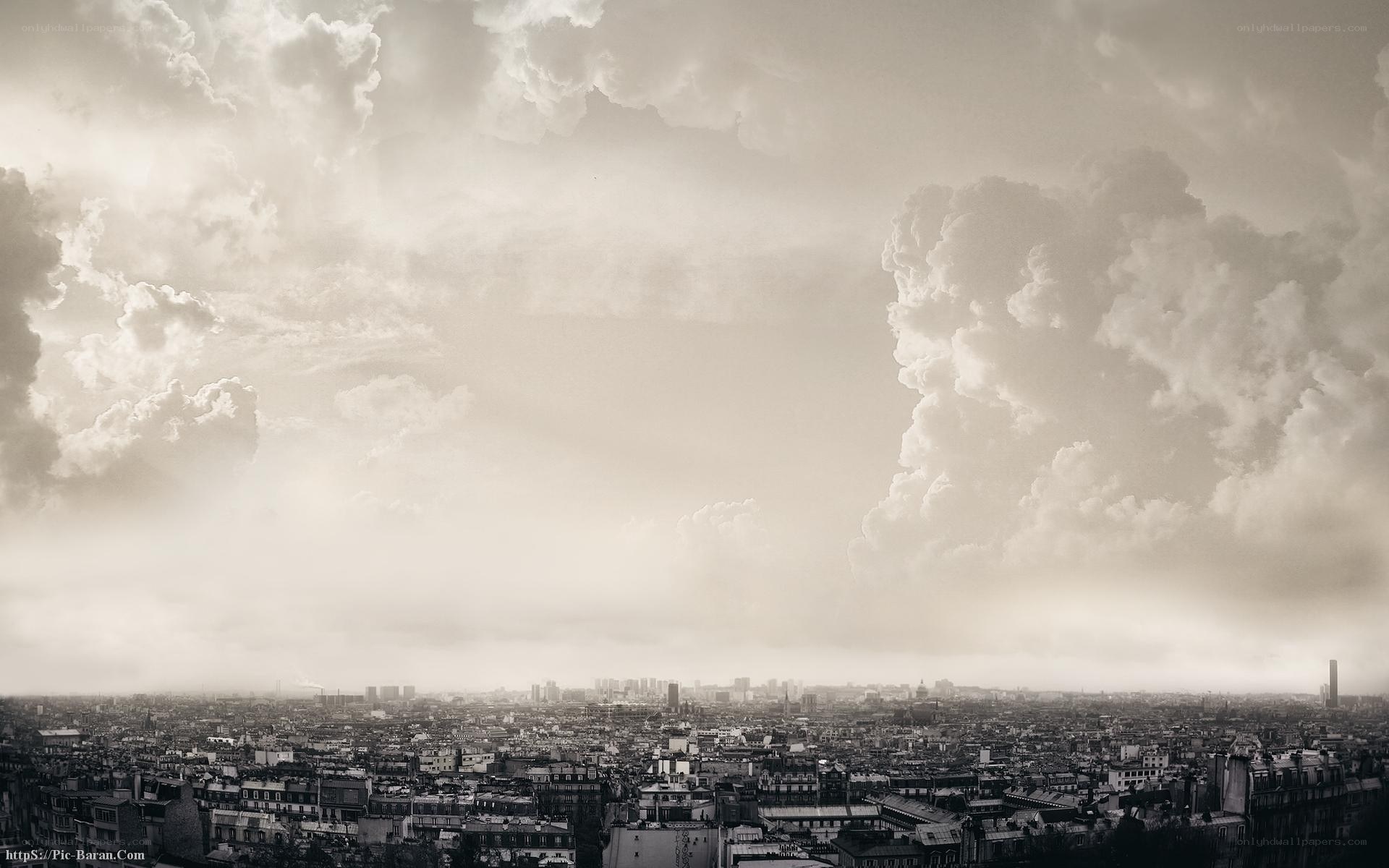 cityscape under stormy sky