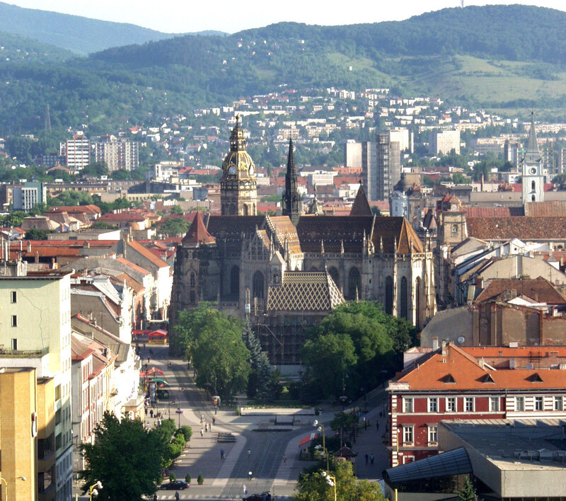 cityscape with cathedral and hills