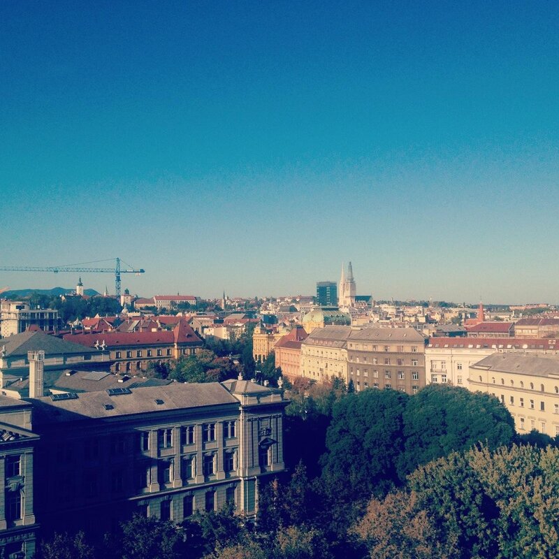 cityscape with crane and cathedral