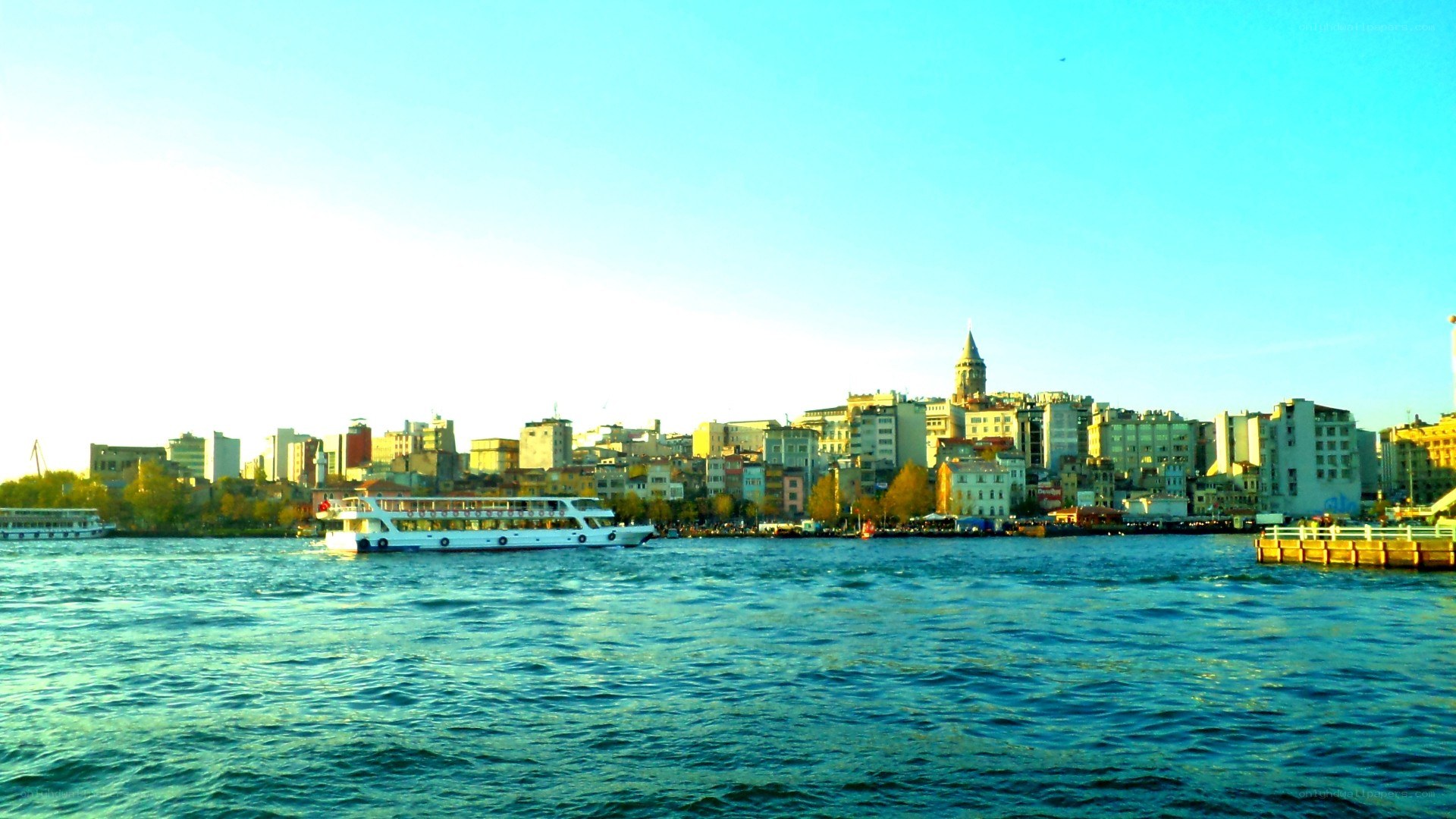 cityscape with ferry on water