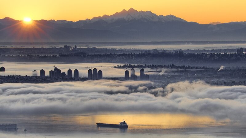 Cityscape with Fog and Mountains