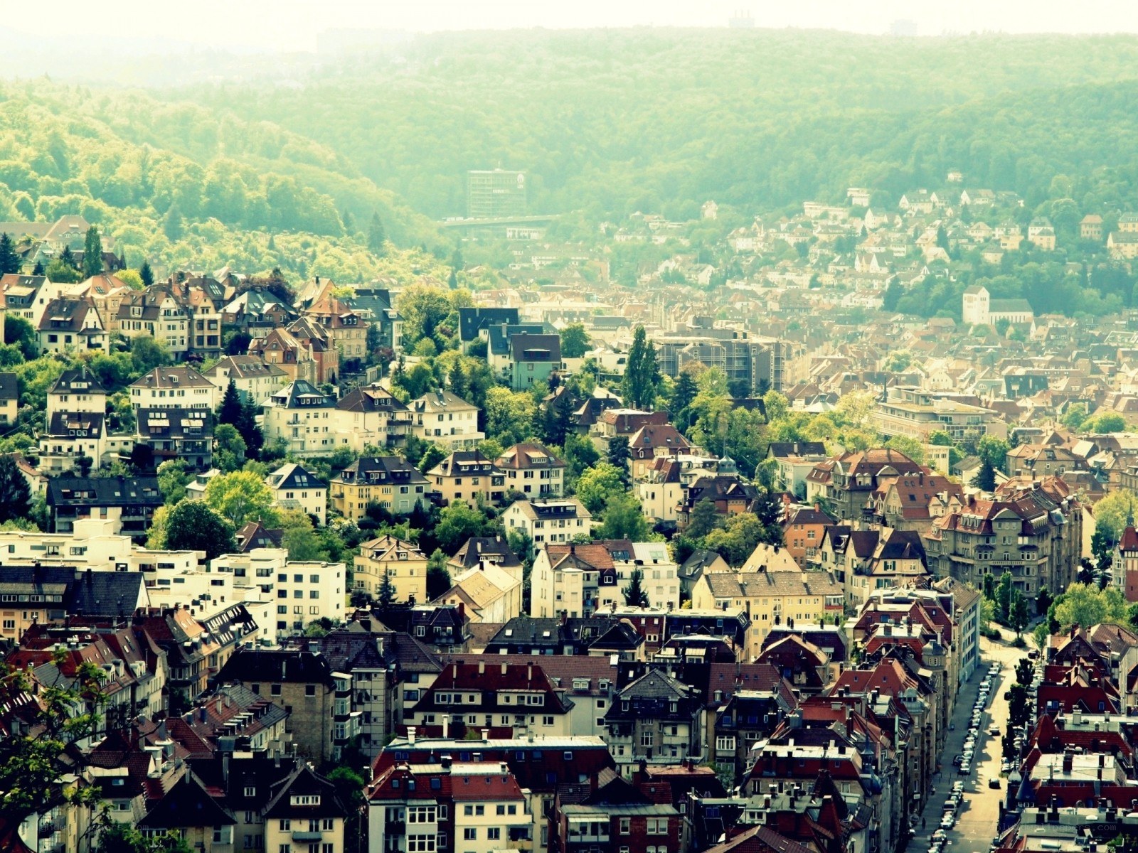 cityscape with green hills